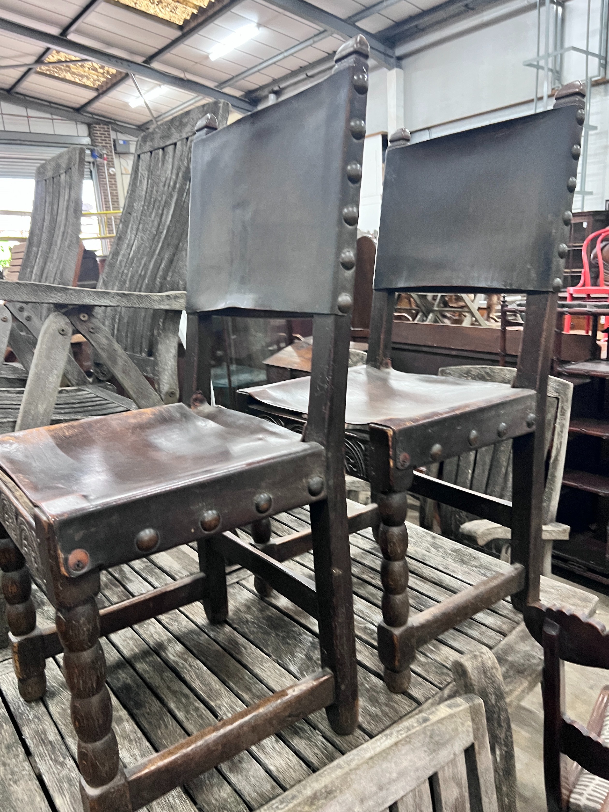 A set of six 17th century style oak dining chairs with leather upholstery *Please note the sale commences at 9am.